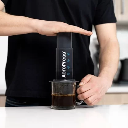 aeropress brewer with coffee in use