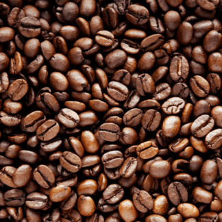 Roasted specialty coffee beans spread out, highlighting the uniform medium roast.